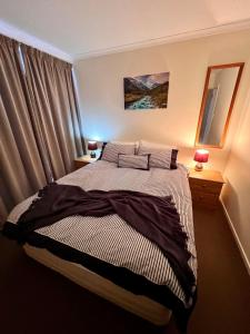 Letto o letti in una camera di Methven Mountain View Apartment