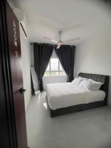 a bedroom with a bed and a window at Aisywara Homestay Kuala Terengganu in Kuala Terengganu