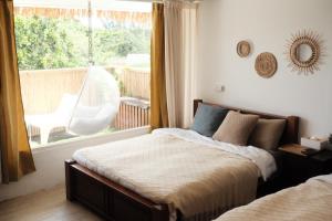 Postel nebo postele na pokoji v ubytování SolChill INN 日丘旅店 -墾丁南灣