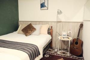 Postel nebo postele na pokoji v ubytování SolChill INN 日丘旅店 -墾丁南灣