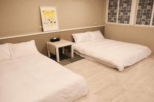 Postel nebo postele na pokoji v ubytování SolChill INN 日丘旅店 -墾丁南灣
