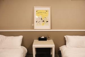 Postel nebo postele na pokoji v ubytování SolChill INN 日丘旅店 -墾丁南灣