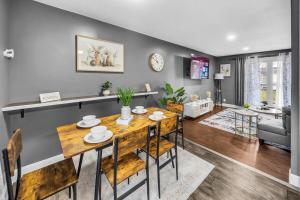 a dining room and living room with a table and chairs at Modern 4bedrooms Home Near Lake Decatur in Decatur