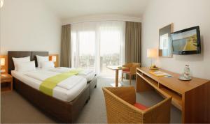 Postel nebo postele na pokoji v ubytování Hotel St Elisabeth