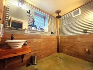 a bathroom with a sink and a mirror at Cozy Spa Sanctuary - Steps to Restaurants and Shopping in Portland +37 photos