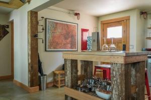 a kitchen with a counter with pots and pans at Cozy Spa Sanctuary - Steps to Restaurants and Shopping in Portland