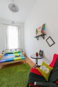 A bed or beds in a room at Friends Hostel & Apartments
