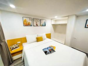 Voodi või voodid majutusasutuse Mango Apartment and Homestay - HaNoi railway station toas