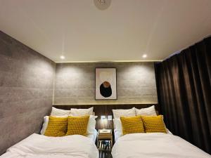 Katil atau katil-katil dalam bilik di e-hostel 心斎橋 302