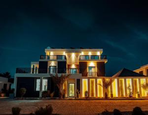 a large building with lights on at night at The Villa Haramous in Djibouti