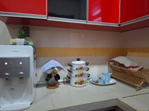 a kitchen counter with a counter top with a counter top at DN Homestay Kuala Terengganu - Feel At Home in Kuala Terengganu