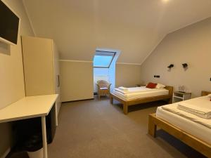Postel nebo postele na pokoji v ubytování Hotel Sanvilla