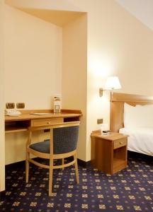 Postel nebo postele na pokoji v ubytování Hotel Ovest