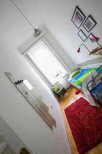 A bed or beds in a room at Friends Hostel & Apartments
