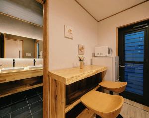 a kitchen with a counter and a sink and a refrigerator at 如意二条城Ruyi Nijojo in Kyoto +23 photos