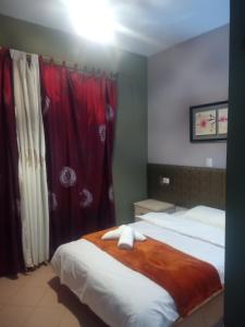 Letto o letti in una camera di Prince Hotel Fier