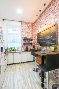 A kitchen or kitchenette at Friends Hostel & Apartments