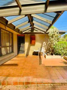 a patio with awning on top of a house at Home in Doncaster with Gardens, Near Shops & Transport in Doncaster