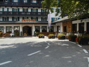 an empty street in front of a hotel at Hotel Savoia dal 1924 in San Martino di Castrozza