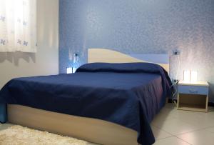 Ένα ή περισσότερα κρεβάτια σε δωμάτιο στο B&B Villa Virginia