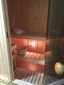a sauna with bowls and pans on the shelves at Evripides Hotel in Athens