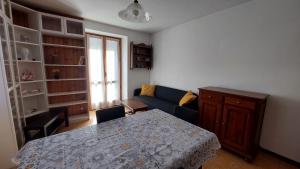 a living room with a table and a couch at LinHaus in Limone Piemonte