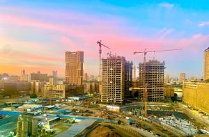 a view of a city with construction cranes at Room for rent - downtown in Cairo