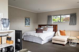 Ένα ή περισσότερα κρεβάτια σε δωμάτιο στο Haven in Taupō