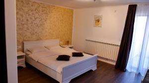 Postel nebo postele na pokoji v ubytování Casa Ambientt