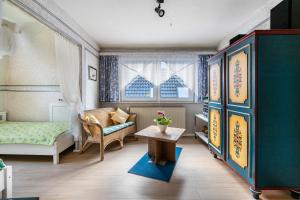 a room with a bed and a couch and a table at Erholung Pur in Hennstedt