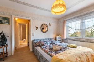 a bedroom with a bed and a large window at Erholung Pur in Hennstedt
