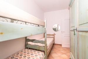 Posteľ alebo postele v izbe v ubytovaní Appartamento Primula
