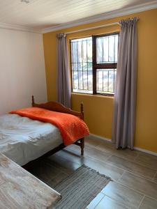 Ένα ή περισσότερα κρεβάτια σε δωμάτιο στο Die Boomhuis