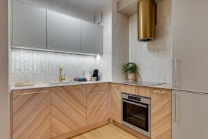 Kuchyňa alebo kuchynka v ubytovaní Merwede Residence - 100 metrów od plaży by Downtown Apartments