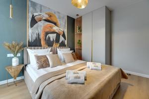 Posteľ alebo postele v izbe v ubytovaní Merwede Residence - 100 metrów od plaży by Downtown Apartments + 17 fotografií