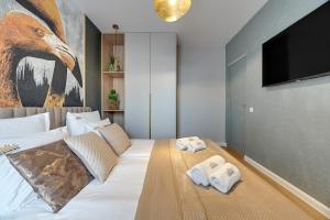 Posteľ alebo postele v izbe v ubytovaní Merwede Residence - 100 metrów od plaży by Downtown Apartments