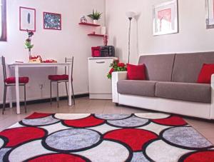 a living room with a couch and a table at The Relax Apartment in Montagnana