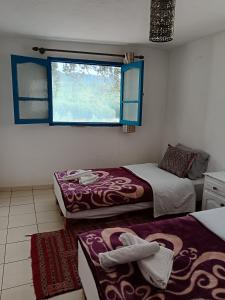 Postel nebo postele na pokoji v ubytování Relais De Tahla
