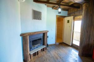 a living room with a fireplace in a house at Villa Y1 with Hot Pool, Jacuzzi , Sauna - Sapanca in Sapanca