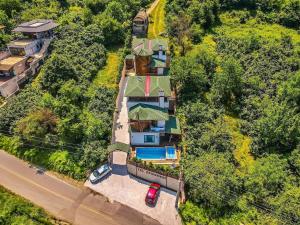 an overhead view of a house with a car parked next to it at Villa Y1 with Hot Pool, Jacuzzi , Sauna - Sapanca in Sapanca
