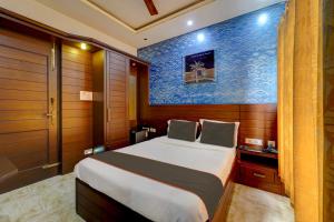 Ένα ή περισσότερα κρεβάτια σε δωμάτιο στο Hotel O ENCLAVE RESIDENCY NEAR AIRPORT