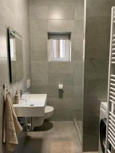 Koupelna v ubytování City Center Apartments - Moderna Brno Římské náměstí I