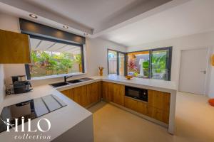 Η κουζίνα ή μικρή κουζίνα στο Kaz'Pépite Villa Saint Gilles by HILO Collection +14 φωτογραφίες