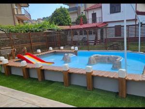 a swimming pool with a play equipment in it at Holiday Gufetto in Pietra Ligure +17 photos