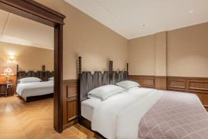 Voodi või voodid majutusasutuse Beijing Xiaofengxian Former Residence Hotel Tiananmen Square Qianmen Store toas