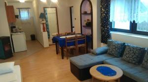 a living room with a couch and a table at House Ilija Hodak in Seliste Dreznicko