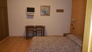 Postel nebo postele na pokoji v ubytování Albergo "da Tosca"