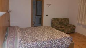 Postel nebo postele na pokoji v ubytování Albergo "da Tosca"