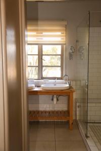 a bathroom with a sink and a window at Ben's Bed and Breakfast in Pretoria +26 photos