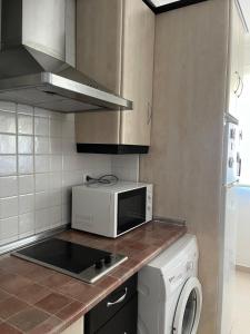 Η κουζίνα ή μικρή κουζίνα στο Estudio zona residencial